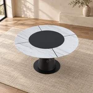 White Marble Round Table with Black Lazy Susan on Cone Base in ivory — in a room setting