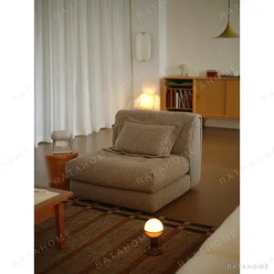 Lili Single Armless Module Seat in Sand Textured Fabric — in a room setting