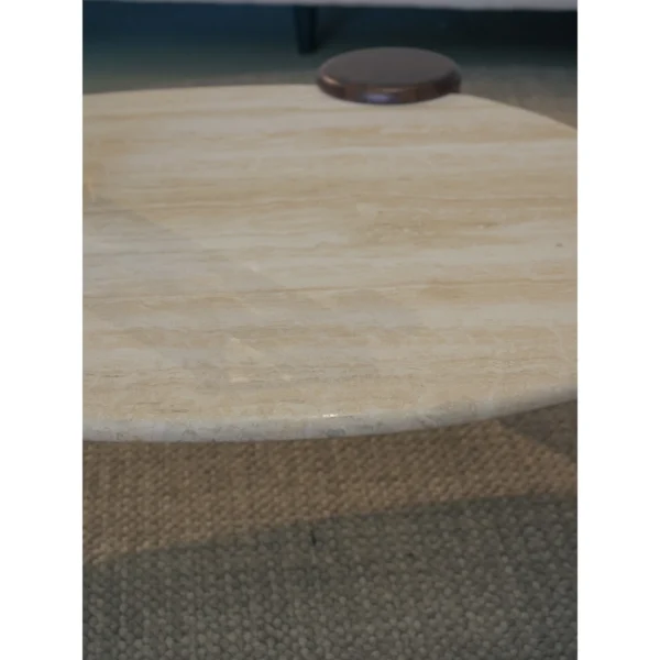 Island Travertine Coffee Table on Dark Wood Cylinder Legs in oatmeal — in a room setting