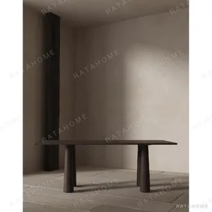 Wutong Black Walnut Dining Table with Sculpted Legs in walnut — in a room setting