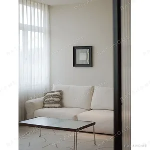 Zhiyu Woven Feather Sofa Bed in White with Curved Arms — in a room setting