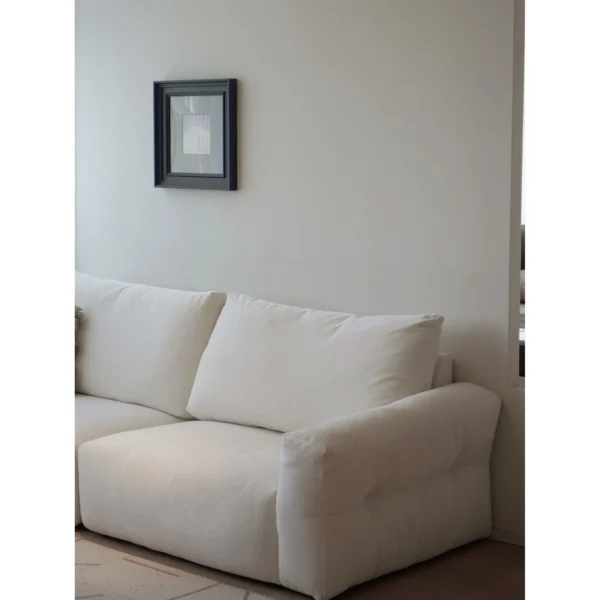 Zhiyu Woven Feather Sofa Bed in White with Curved Arms — in a room setting