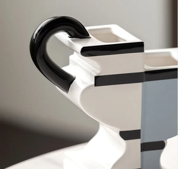 Postmodern Two-Tone Geometric Vase with Twin Loop Ears in ivory — in a room setting