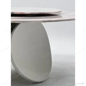 Pink Stone Round Table with Turntable on Twin-Leaf Base in rose stone — in a room setting