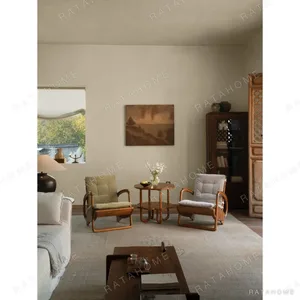 Dragon Boat Teak Lounge Chair with Woven Rattan Seat in clay — in a room setting