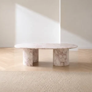 Pink Marble Oval Dining Table on Twin Stone Cylinders in rose stone — front view