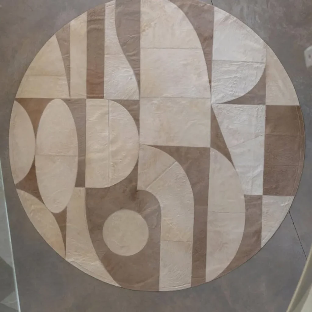 Durable Cowhide Geometric Rug in Sand and Taupe — front view