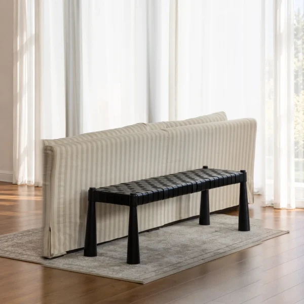 Hand-Woven Leather Teak Bench in black — in a room setting