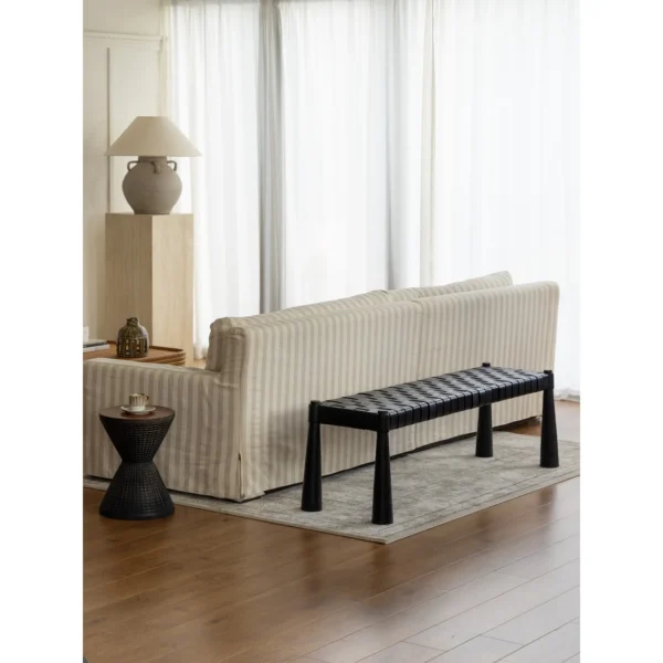 Hand-Woven Leather Teak Bench in black — in a room setting