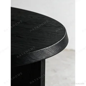 Ellipse Black Oak Dining Table on Twin Panel Legs in black — in a room setting
