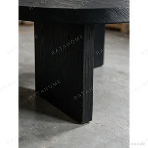 Ellipse Black Oak Dining Table on Twin Panel Legs in black — in a room setting