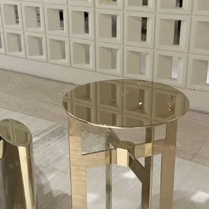 Polished Brass Cross-Frame Round Side Table in brushed brass — in a room setting