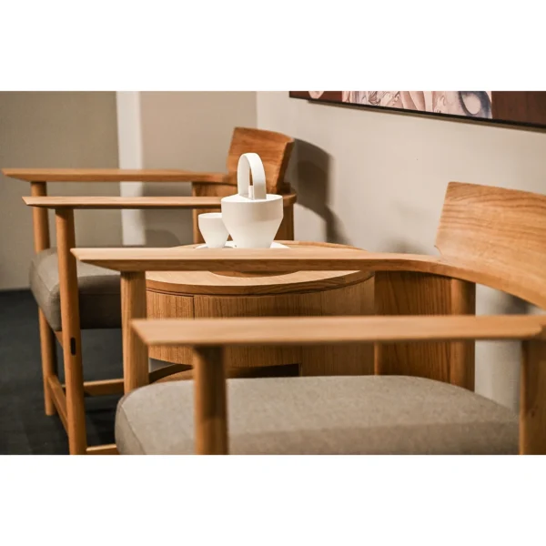 Embrace Solid Oak Armchair in natural oak — in a room setting