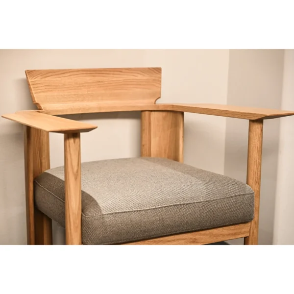 Embrace Solid Oak Armchair in natural oak — in a room setting