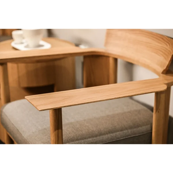 Embrace Solid Oak Armchair in natural oak — in a room setting