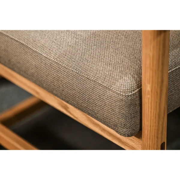 Embrace Solid Oak Armchair in natural oak — in a room setting