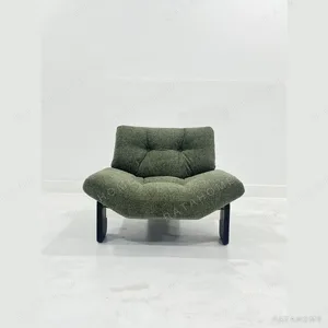 Wide-Seat Italian Lounge Chair in olive — in a room setting