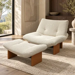 Emmy Cream Bouclé Lounge Chair with Ottoman on Wood Base in oatmeal — in a room setting