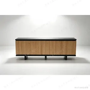 Emory Carved Birch Door Sideboard on Black Base in natural oak — in a room setting