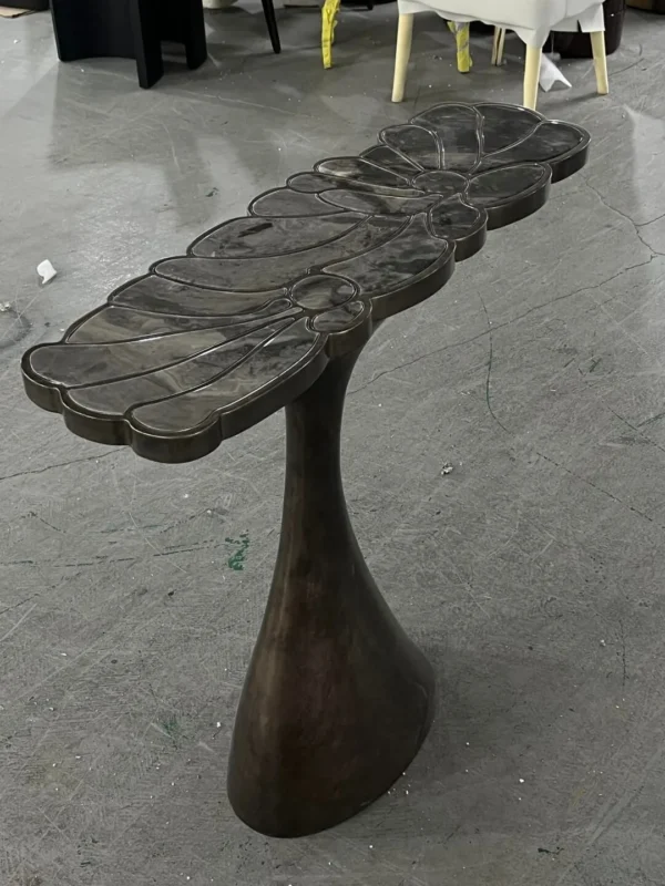 Bronze Scalloped Console on Sculpted Foot in bronze — in a room setting