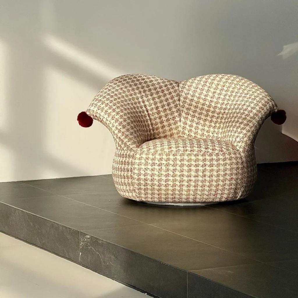 Clown Houndstooth Lounge Chair with Red Pompoms — front view