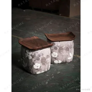 Floral Upholstered Tea Stool with Walnut Saddle Top in slate — in a room setting