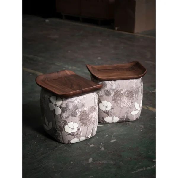 Floral Upholstered Tea Stool with Walnut Saddle Top in slate — in a room setting