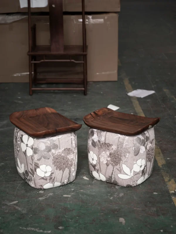 Floral Upholstered Tea Stool with Walnut Saddle Top in slate — in a room setting