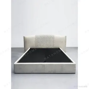 Hand-Woven Suede Headboard Bed with Stud Trim in oatmeal — in a room setting
