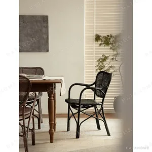 Fan-Back Rattan Chair with Seat Cushion in clay — in a room setting