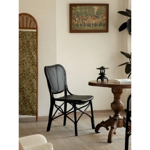 Fan-Back Rattan Chair with Seat Cushion in clay — in a room setting