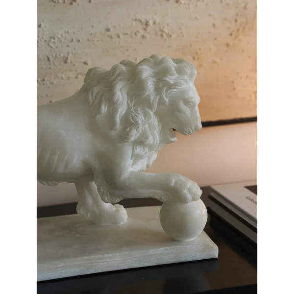 Jade-Effect Guardian Lion with Ball Sculpture in ivory — in a room setting