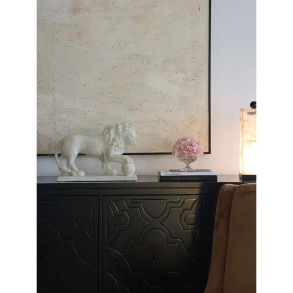 Jade-Effect Guardian Lion with Ball Sculpture in ivory — in a room setting