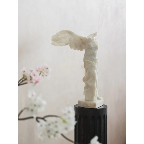 Jade-Effect Winged Victory Sculpture, Matte Finish in ivory — in a room setting