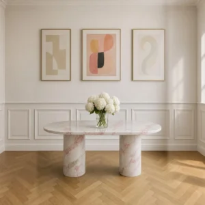 Soft Pink Marble Oval Dining Table on Column Legs in rose stone — front view