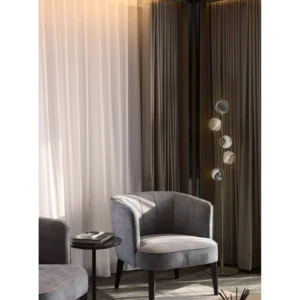 Five Stone-Pattern Disc Floor Lamp on Brass Stem in brushed brass — in a room setting