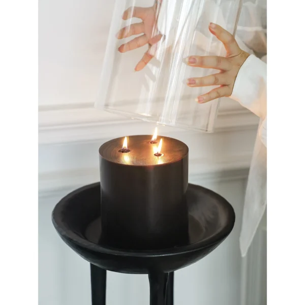Black Wood Tripod Floor Candle Holder with Tray Top in black — in a room setting