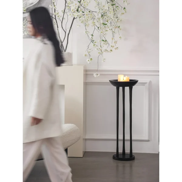 Black Wood Tripod Floor Candle Holder with Tray Top in black — in a room setting