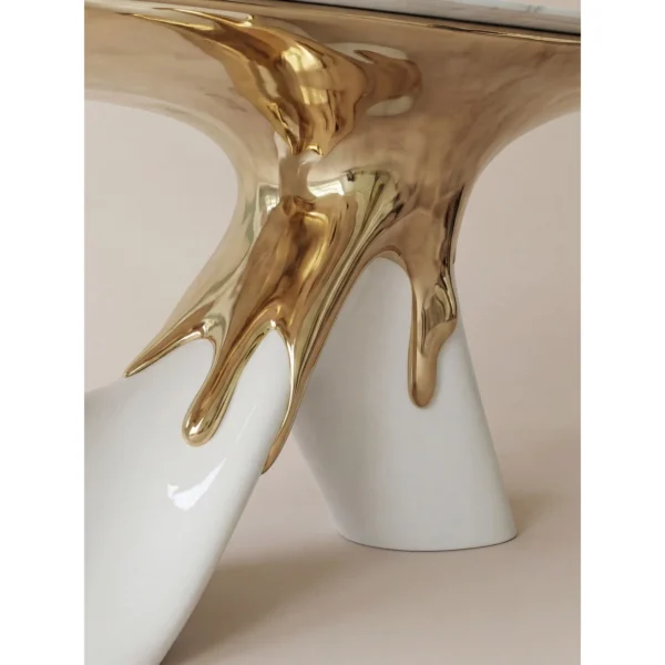 White Marble Table on Molten Gold Sculptural Base in ivory — in a room setting