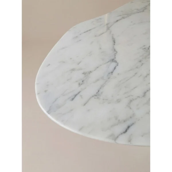 White Marble Table on Molten Gold Sculptural Base in ivory — in a room setting