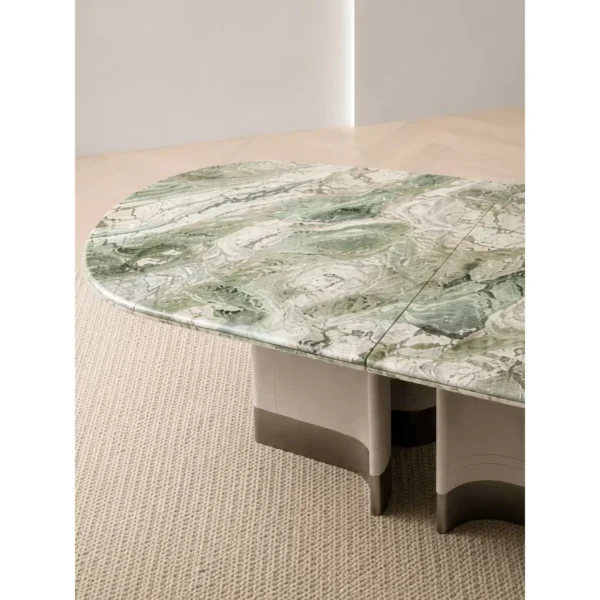 Victoria Green Stone Oval Dining Table on Fluted Stone Base in olive — in a room setting
