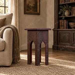 Forest Trace Carved Solid Wood Side Table with Arched Base in clay — in a room setting