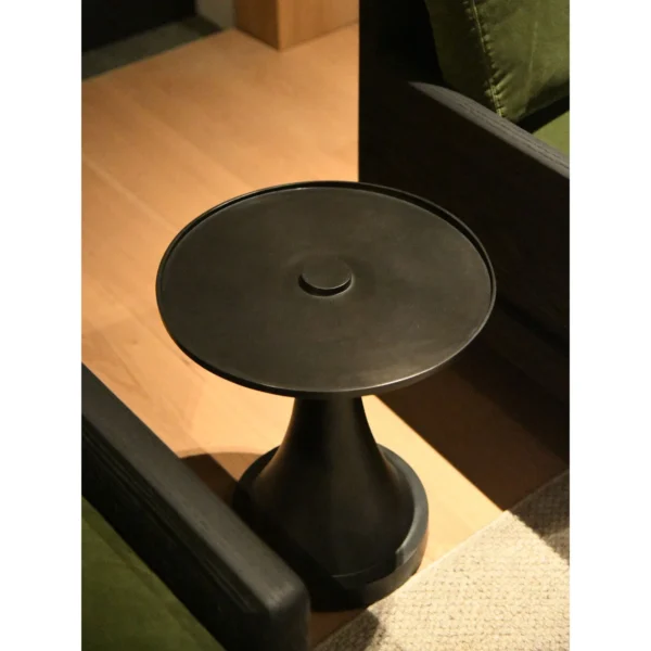 Forged Brass Round Side Table with Textured Top, 40 cm in black — in a room setting