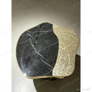 Cloud Black Marble Side Table on Forged Black and Gold Base in black — in a room setting