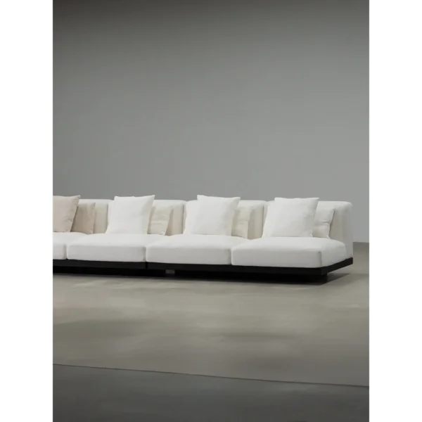 Free-Form Modular Sofa in White Linen with Dark Wood Base — in a room setting