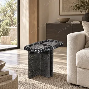Black Fossil Marble Tray Side Table on Travertine Base in black — in a room setting