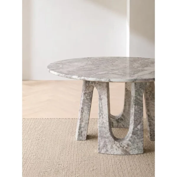 Four Seasons Pink-Green Marble Round Table on Arched Base in rose stone — in a room setting