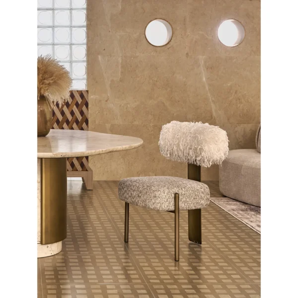 Four Seasons Pink Stone Wave-Edge Dining Table on Brass Base in rose stone — in a room setting