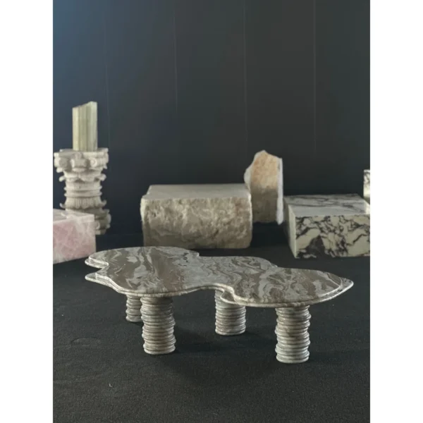 Free-Form Wave Marble Coffee Table on Fluted Legs in slate — in a room setting