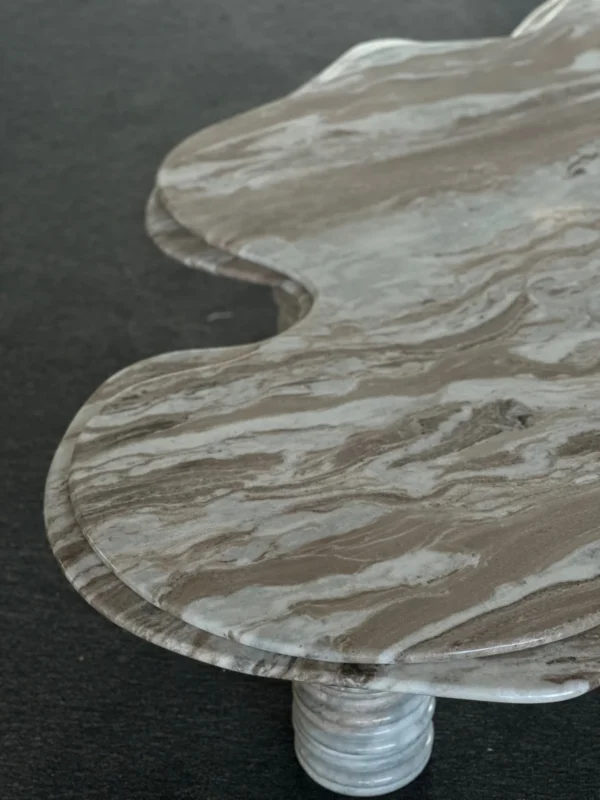 Free-Form Wave Marble Coffee Table on Fluted Legs in slate — in a room setting